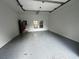 The interior of this garage is spacious and has painted floor, plus a window looking to the exterior at 683 Pryor Sw St # C, Atlanta, GA 30315
