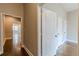 Hallway showcases three white doors and hardwood floors to other rooms at 683 Pryor Sw St # C, Atlanta, GA 30315
