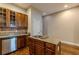 Kitchen features a granite countertop island and wooden cabinetry at 683 Pryor Sw St # C, Atlanta, GA 30315