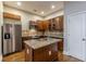 Kitchen featuring stainless steel appliances, island, and wood cabinets at 683 Pryor Sw St # C, Atlanta, GA 30315