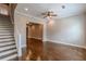 Living room featuring hardwood floors, open floor plan, and staircase at 683 Pryor Sw St # C, Atlanta, GA 30315