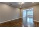 Living room with hardwood floors that connects to a dining area at 683 Pryor Sw St # C, Atlanta, GA 30315