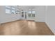 Bright, open dining space with hardwood floors, large windows, and a modern chandelier at 231 Strawberry Ln, Woodstock, GA 30189