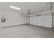 Spacious two-car garage with painted walls and concrete floor, providing ample parking at 231 Strawberry Ln, Woodstock, GA 30189