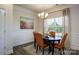 Cozy dining room with warm lighting, decorative wall art, and comfortable seating for four at 255 Eason St, Bowdon, GA 30108