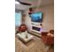 Cozy living room features a faux fireplace and modern finishes at 4835 Station Lane -Lot 27, Union City, GA 30349
