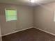 Neutral bedroom with window and blinds, carpeted floor, and fresh paint at 624 Moselle Sw Dr, Mableton, GA 30126