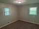 Small bedroom with neutral walls and windows at 624 Moselle Sw Dr, Mableton, GA 30126