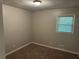 Cozy bedroom with neutral paint, window, and plush carpet at 624 Moselle Sw Dr, Mableton, GA 30126