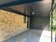 Covered carport featuring brick walls and wrought iron at 624 Moselle Sw Dr, Mableton, GA 30126