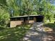 Traditional brick home with covered carport and mature trees at 624 Moselle Sw Dr, Mableton, GA 30126