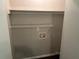 Simple laundry room with a wire shelf and hookups at 624 Moselle Sw Dr, Mableton, GA 30126