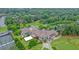 Aerial view of the golf course clubhouse with tennis courts and parking at 210 Malvern Pl, Roswell, GA 30076