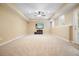 Finished basement offers a bright entertainment area with a ceiling fan and a tv mounted on the wall at 210 Malvern Pl, Roswell, GA 30076
