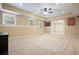 Finished basement with neutral walls, carpet, recessed lighting, and a door to the outside at 210 Malvern Pl, Roswell, GA 30076