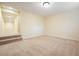 Spacious basement with plush carpet and a connecting hallway with carpeted stairs at 210 Malvern Pl, Roswell, GA 30076