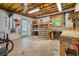 Unfinished basement workshop area with pegboard walls, work benches, and natural light at 210 Malvern Pl, Roswell, GA 30076