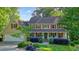 Charming two-story home featuring a welcoming front porch and beautifully landscaped front yard at 210 Malvern Pl, Roswell, GA 30076