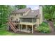 View of the back of the house, screened in porch and deck at 210 Malvern Pl, Roswell, GA 30076