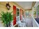 Cozy front porch with rocking chairs and decorative plants, perfect for relaxing outdoors at 210 Malvern Pl, Roswell, GA 30076