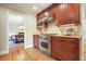 Gourmet kitchen featuring stainless steel appliances, cherry cabinets, granite countertops and hardwood floors at 210 Malvern Pl, Roswell, GA 30076
