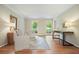 Spacious living room with hardwood floors, neutral paint, and stylish furniture at 210 Malvern Pl, Roswell, GA 30076