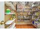 Walk-in pantry with custom shelving offering ample storage for food, cookware, and small appliances at 210 Malvern Pl, Roswell, GA 30076