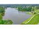 Scenic aerial view of the lush green golf course surrounding a tranquil pond at 210 Malvern Pl, Roswell, GA 30076