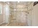 Stunning glass shower with dual shower heads, tiled accents, and a modern design at 210 Malvern Pl, Roswell, GA 30076
