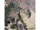 Aerial view of the 15-acre property with large wooded section and a residential section at 4392 Lower Fayetteville Rd, Sharpsburg, GA 30277
