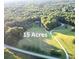 Aerial view of 15-acre property, with woods surrounding the home and open area at 4392 Lower Fayetteville Rd, Sharpsburg, GA 30277