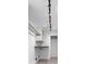 Walk-in closet with custom shelving and lighting for optimal organization at 4392 Lower Fayetteville Rd, Sharpsburg, GA 30277