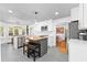 Beautiful kitchen with white cabinets, stainless steel appliances, island with seating at 4392 Lower Fayetteville Rd, Sharpsburg, GA 30277