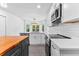 Modern kitchen with an island, stainless steel appliances, and bright lighting at 4392 Lower Fayetteville Rd, Sharpsburg, GA 30277