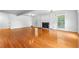 Bright living room with a fireplace and hardwood flooring offers a welcoming space at 4392 Lower Fayetteville Rd, Sharpsburg, GA 30277