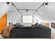 Cozy media room with a large sectional couch, projector, and screen for ultimate entertainment at 4392 Lower Fayetteville Rd, Sharpsburg, GA 30277