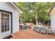 Spacious deck with ample seating, dining, and grill areas and wooded backdrop at 4392 Lower Fayetteville Rd, Sharpsburg, GA 30277