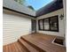 The deck area features stairs, a door and windows to the living area at 4392 Lower Fayetteville Rd, Sharpsburg, GA 30277