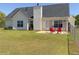 The backyard has a patio and is fenced in for outdoor privacy and safety at 502 Owens Springs Ln, Mcdonough, GA 30252