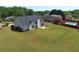 Large fenced backyard with a patio, ideal for pets and outdoor activities, with neighborhood pool at 502 Owens Springs Ln, Mcdonough, GA 30252