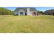 A spacious fenced backyard with a patio, perfect for outdoor entertaining and Gathering activities at 502 Owens Springs Ln, Mcdonough, GA 30252