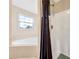 Bathroom view showing a soaking tub and shower with dark shower curtain at 502 Owens Springs Ln, Mcdonough, GA 30252