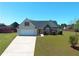 Well maintained single Gathering house showing driveway, lawn, trees and bushes at 502 Owens Springs Ln, Mcdonough, GA 30252