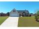 Charming home with a well-manicured front yard, inviting curb appeal, and a spacious driveway at 502 Owens Springs Ln, Mcdonough, GA 30252