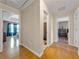 Hallway view showcasing access to bedrooms, bathrooms, and features hardwood floors, neutral paint, and great flow at 502 Owens Springs Ln, Mcdonough, GA 30252