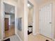 Hallway showcasing a half-bath and a view into a room with light-wood floors at 502 Owens Springs Ln, Mcdonough, GA 30252