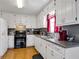 Well-maintained kitchen with white cabinetry, laminate countertops, modern appliances, and natural light from the window at 502 Owens Springs Ln, Mcdonough, GA 30252