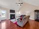Welcoming living room featuring a fireplace and hardwood flooring at 502 Owens Springs Ln, Mcdonough, GA 30252