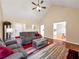 Inviting living room with vaulted ceiling, ceiling fan and comfortable seating at 502 Owens Springs Ln, Mcdonough, GA 30252