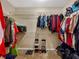 Spacious walk-in closet with shelving and hanging rods for optimal organization and storage at 502 Owens Springs Ln, Mcdonough, GA 30252